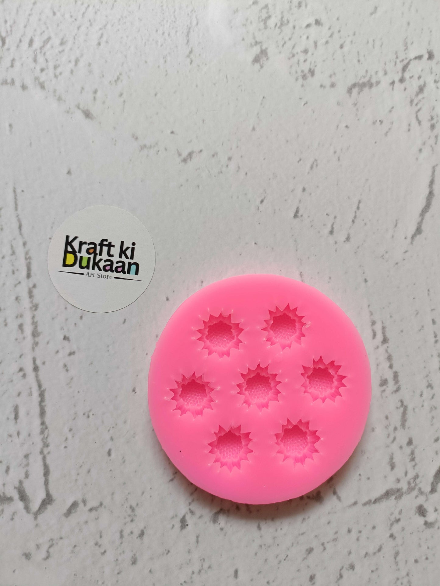 Pink flower silicone mould with 7 cavities, round mold with star-flower impressions