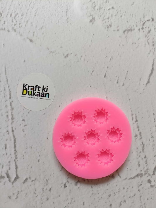 Pink flower silicone mould with 7 cavities, round mold with star-flower impressions