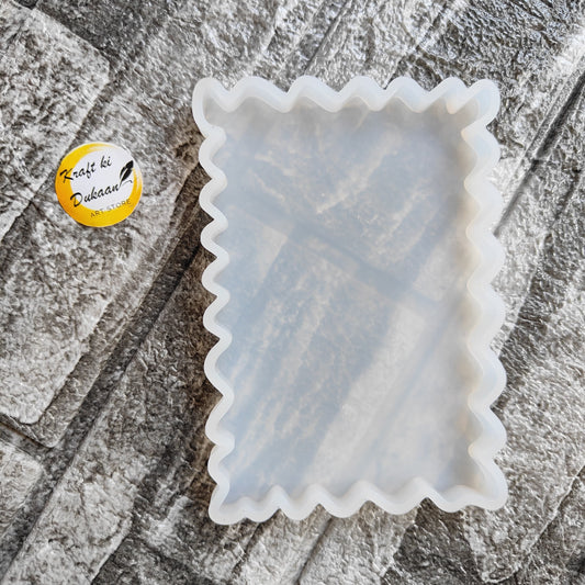 White silicone tray mould with scalloped edges for baking and crafting projects