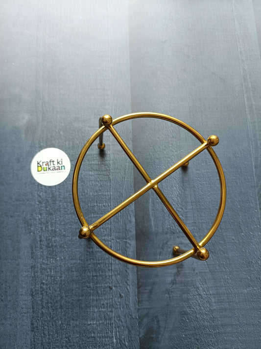 4" metal coaster stand in gold: circular frame with crossed bars and round knobs