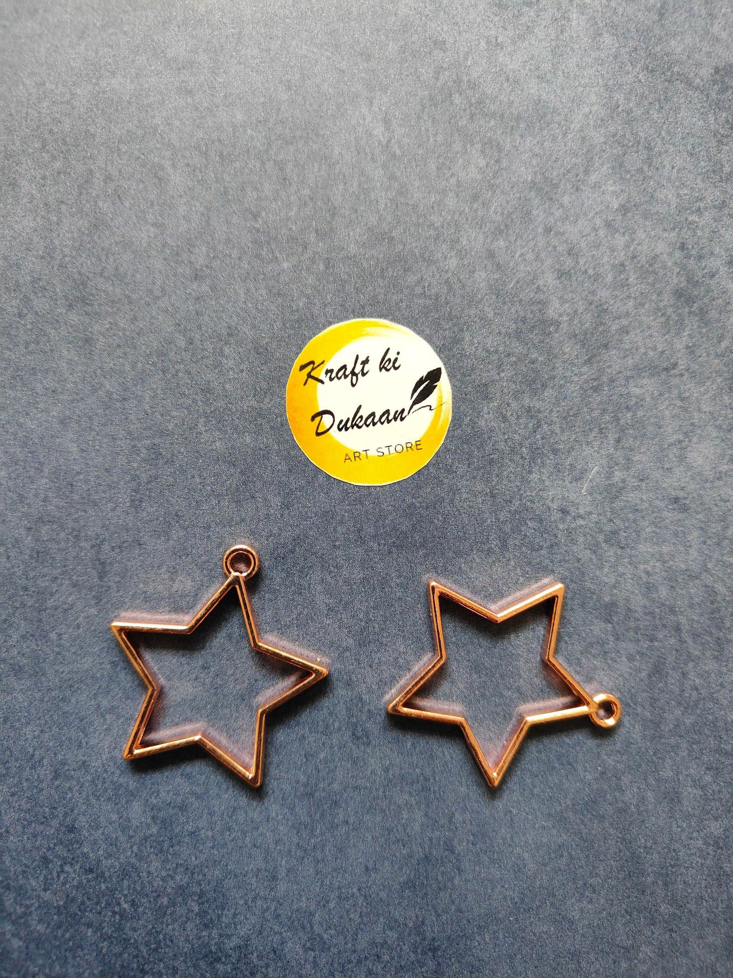 Rose gold star bezel pendant charms, two-piece view with top loop