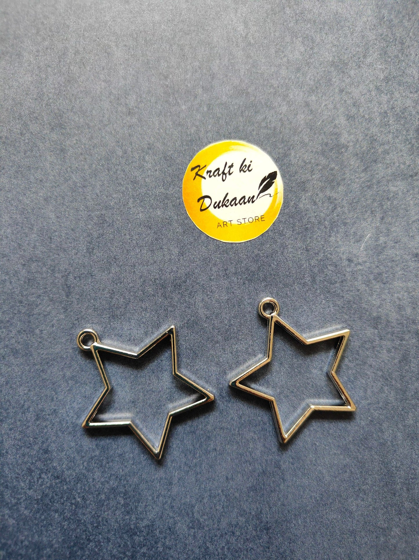 Silver star bezel pendant charms, two-piece view with top loop