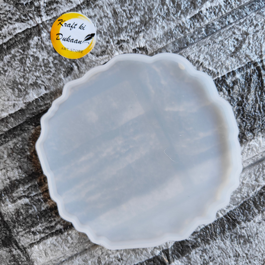 4 inch agate resin mold by Kraft ki Dukaan with scalloped edge on textured gray surface