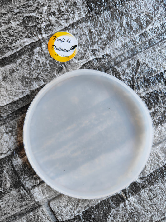 Kraft ki Dukaan 4 inch resin coaster mould in round shape on textured surface