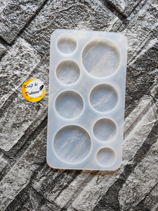 8 cavity silicone mold for resin by Kraft ki Dukaan with various circular shapes on textured surface