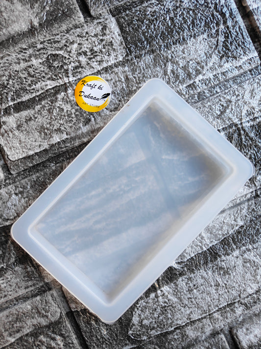 Clear silicone resin rectangle edge mold by Kraft ki Dukaan on textured surface for crafting