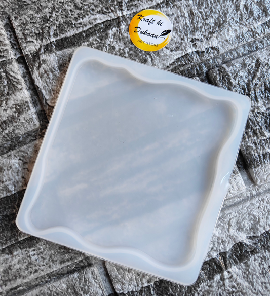 Kraft ki Dukaan zigzag square resin mold with wavy edges on textured stone background