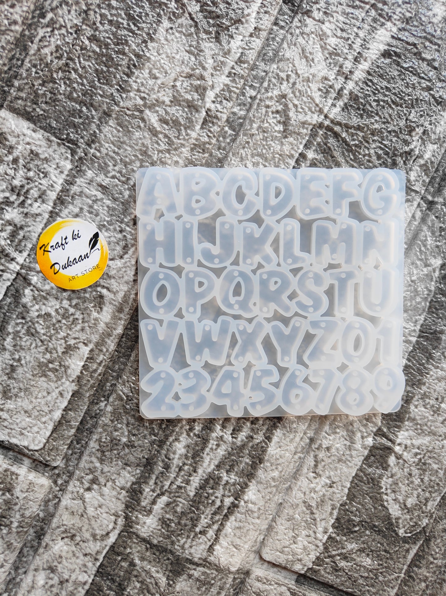 Kraft ki Dukaan mini alphabet mold for resin with uppercase letters and numbers on textured surface