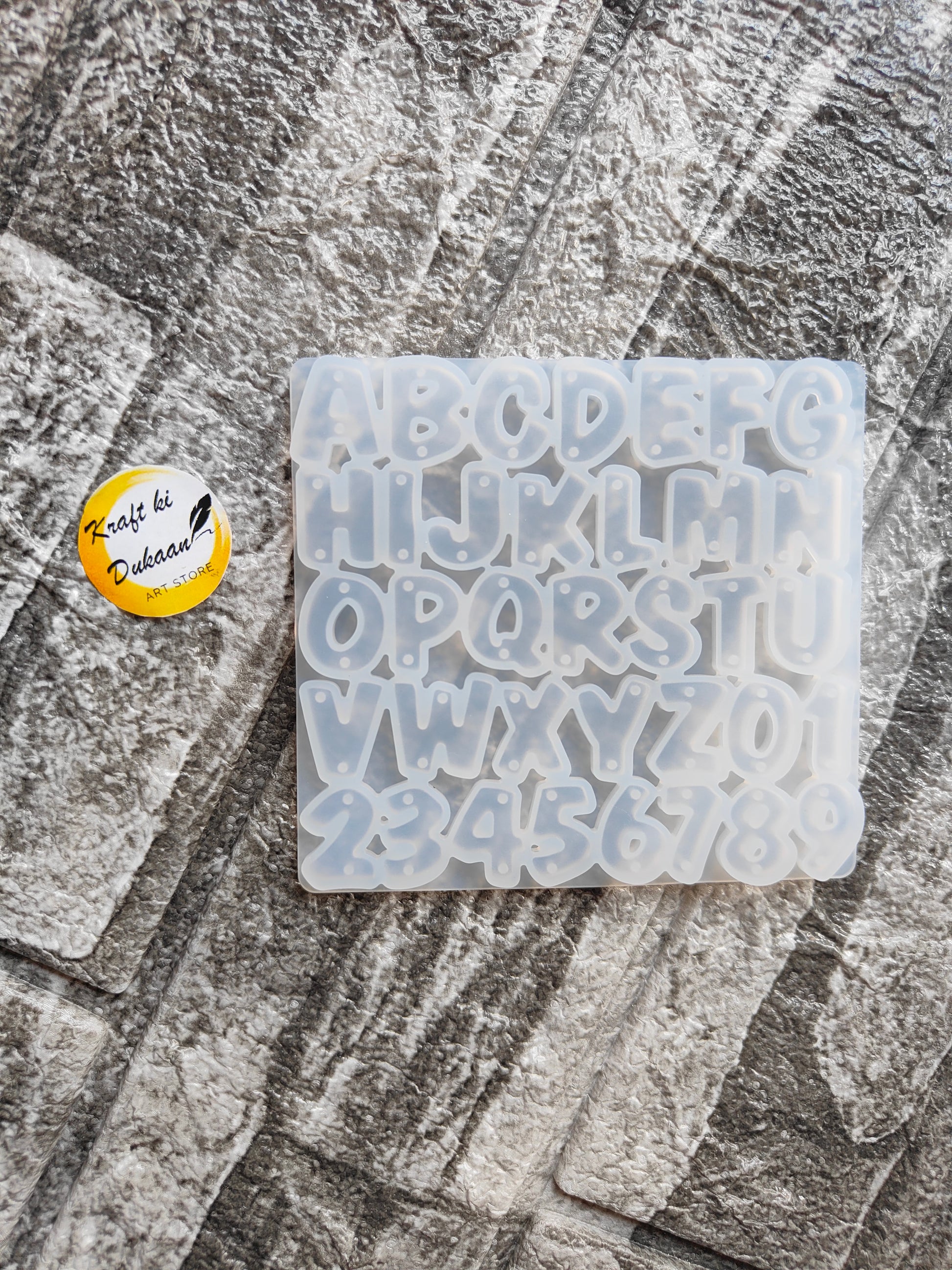 Kraft ki Dukaan mini alphabet mold for resin with uppercase letters and numbers on textured surface