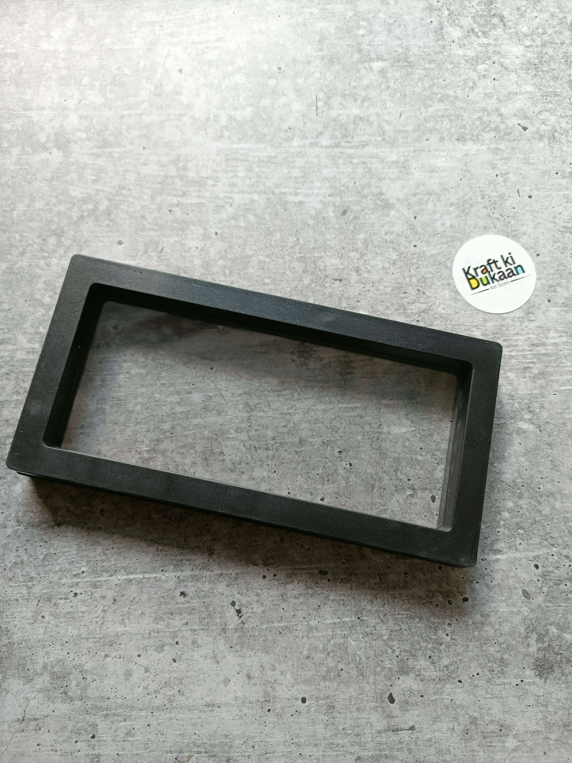 Black packing display box base frame with rectangular window opening, 18x9cm