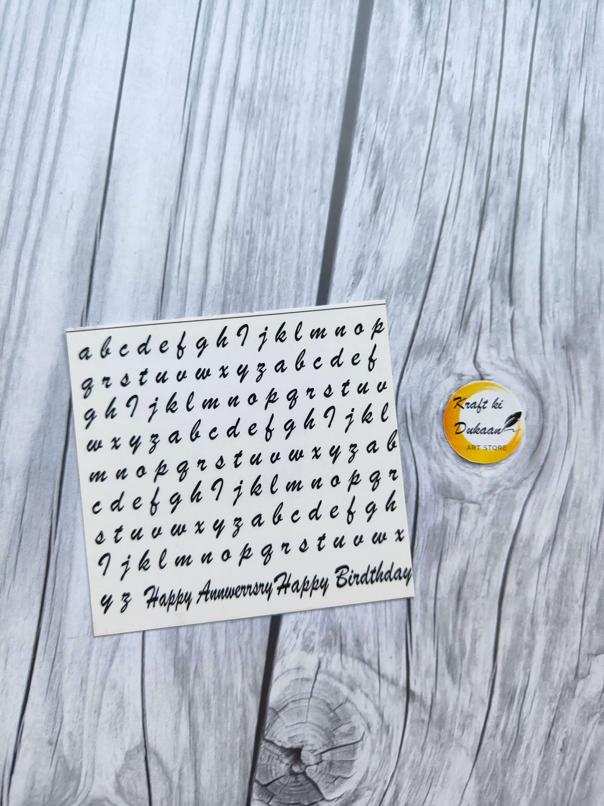 Kraft ki Dukaan mini sticker sheet for keychains featuring decorative letters and birthday messages