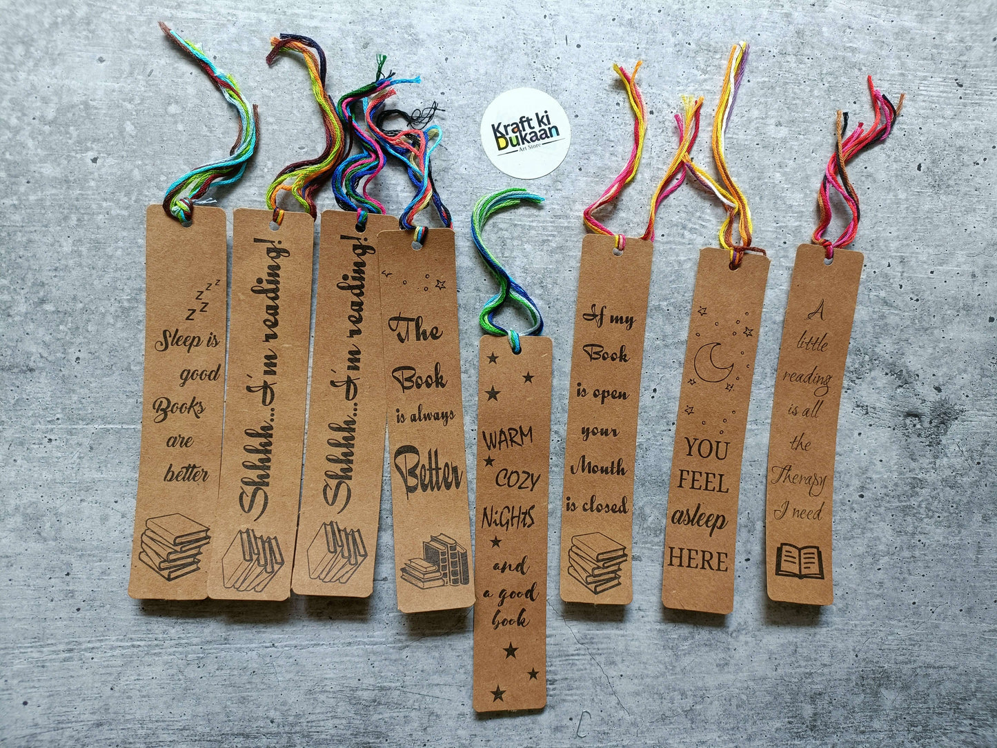 8 kraft paper bookmarks with colorful ribbon ties, printed quotes and stars