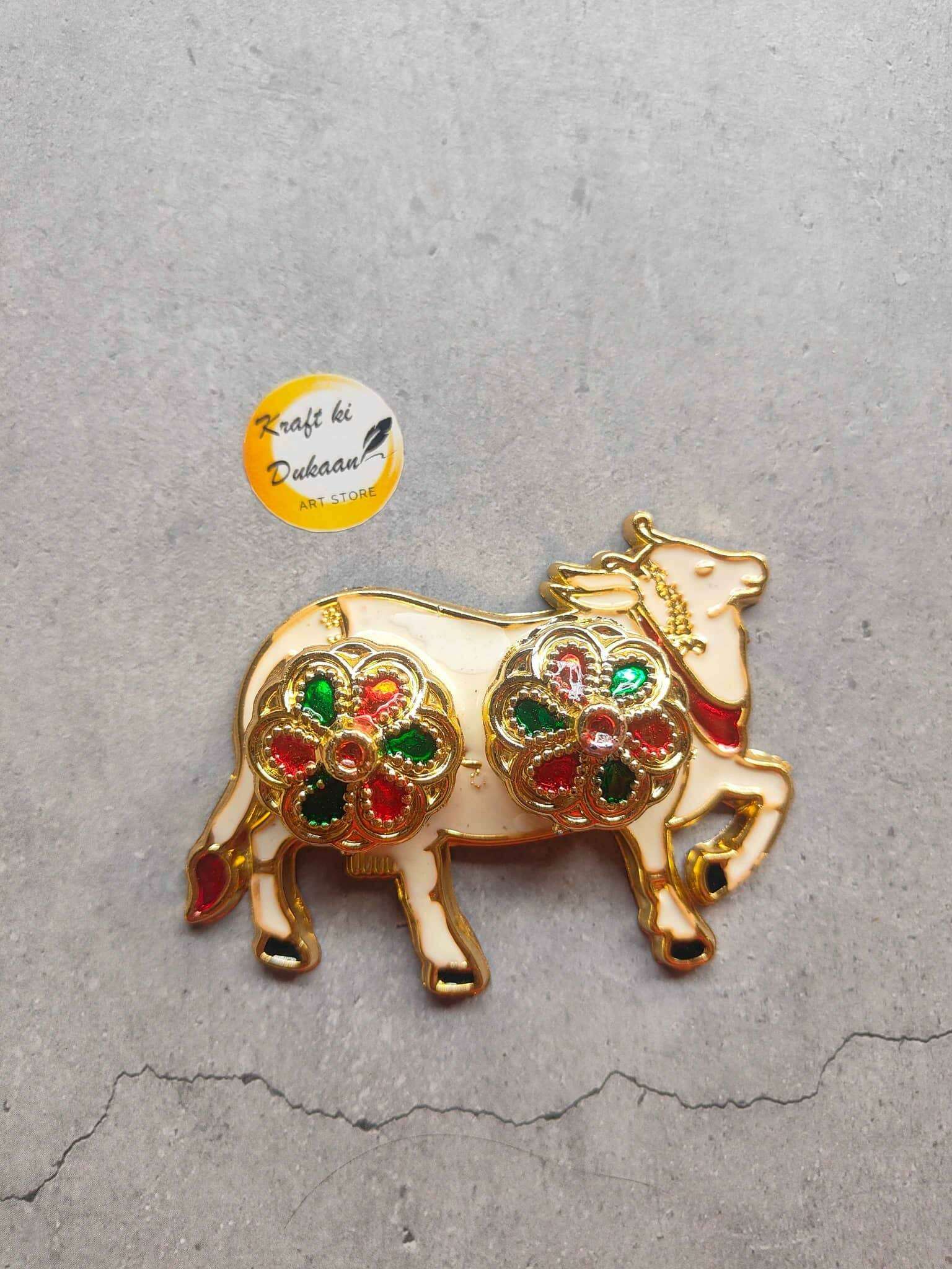 Roli Chawal Plate A4 with ornate gold cow design and colorful gem accents