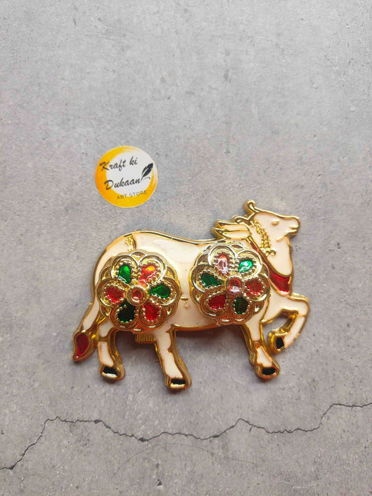 Roli Chawal Plate A4 with ornate gold cow design and colorful gem accents