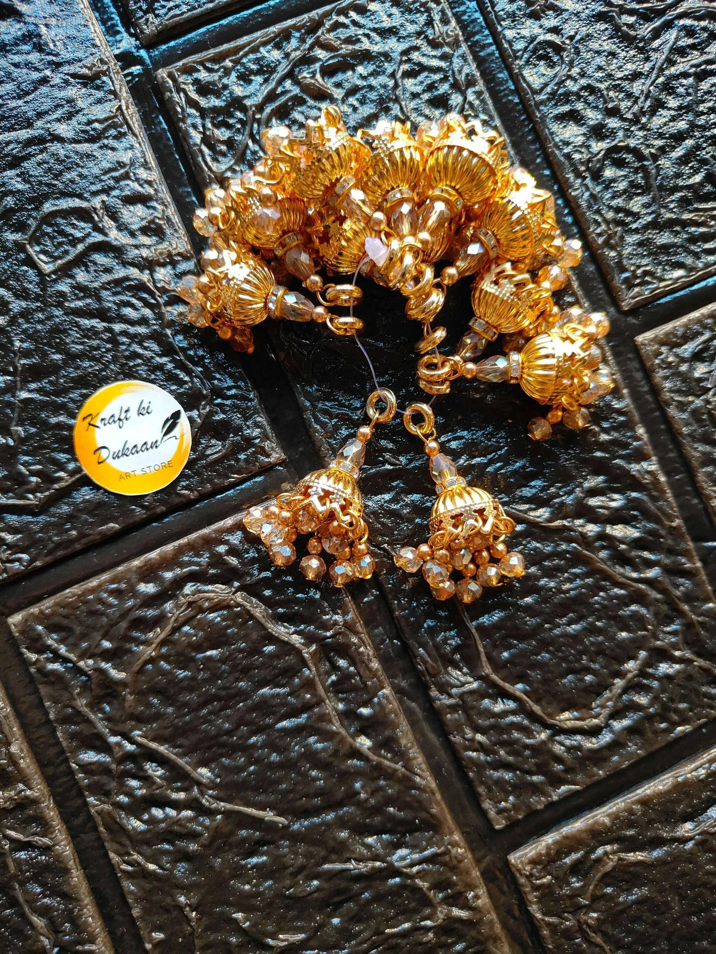 Gold beaded latkan set with jhumka-style tassel drops and loops