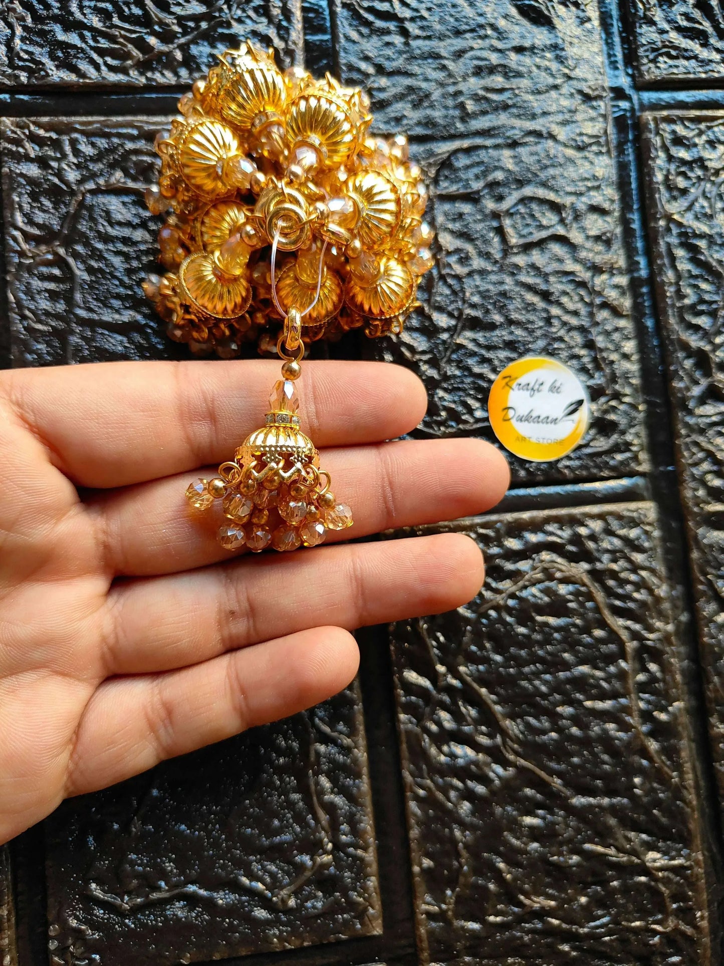 Kraft ki Dukaan gold latkan earring with clustered beads and dangling tassel