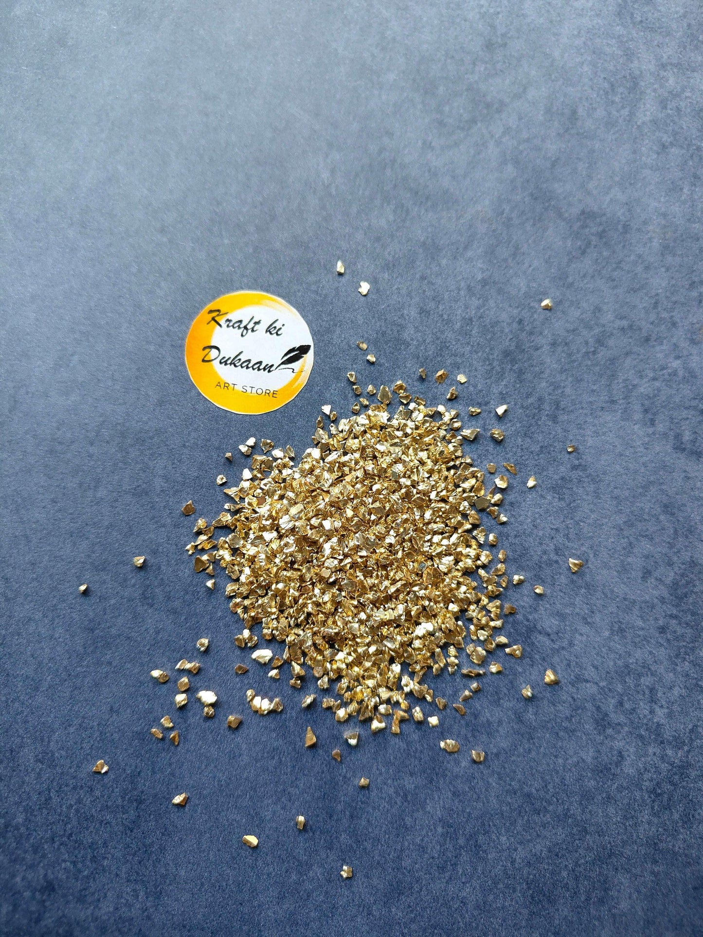 light-gold-granules-for-resin-art-scattered-on-surface