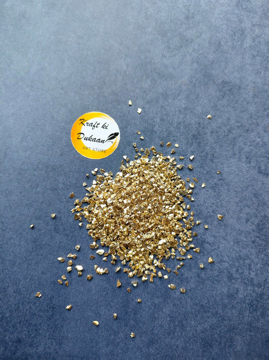 light-gold-granules-for-resin-art-scattered-on-surface