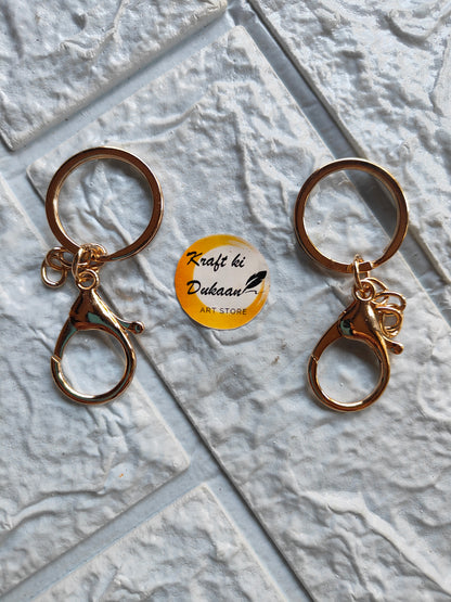 Set of two gold lobster clasp keychains with circular rings for practical use