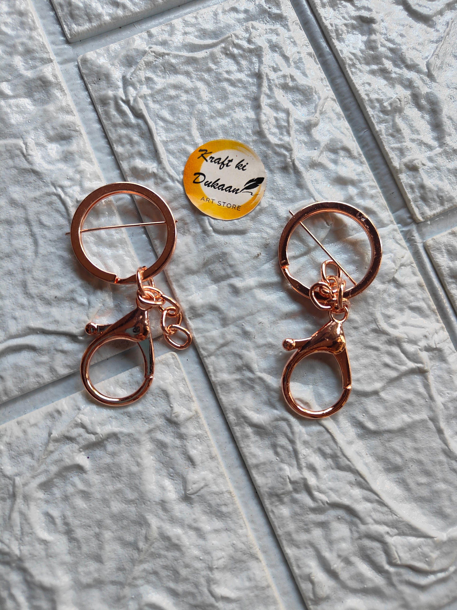 Two rose gold lobster clasp keychains for easy attachment and stylish storage
