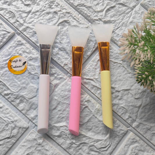 Set of three silicone spatula brushes in pink, yellow, and white for crafting and DIY projects