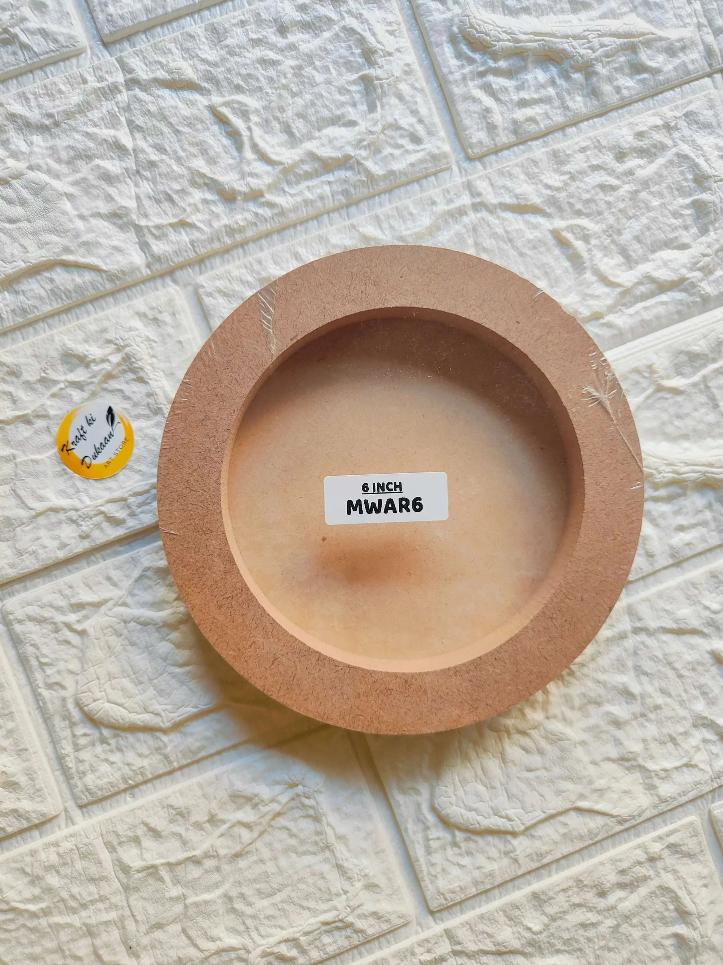 Tan round MDF wall mural, 6 inch inner opening, concentric ring design