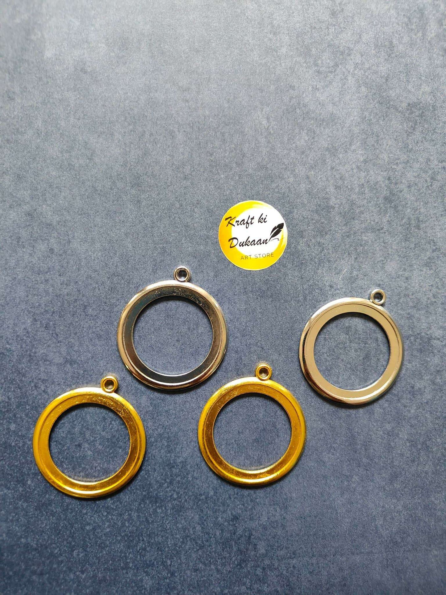 Round thick bezel set, 4 gold-tone and 2 silver-tone circular rings with loops