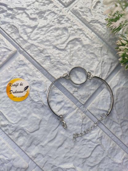 Silver-tone metal round bracelet with circular center link and chain extender