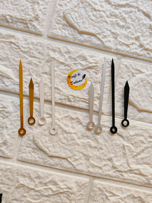 Various metal clock hands for crafts in gold, silver, and black colors for DIY projects