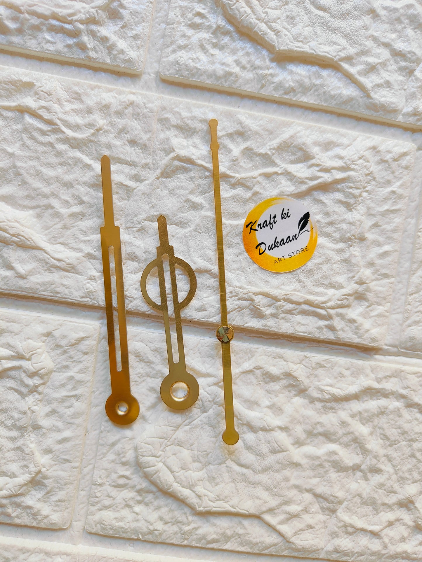 Set of metal clock hands for crafts in gold finish with intricate designs for DIY clock projects