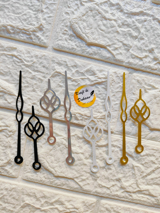 Set of metal clock hands for crafts in black, gold, silver, and white for DIY projects