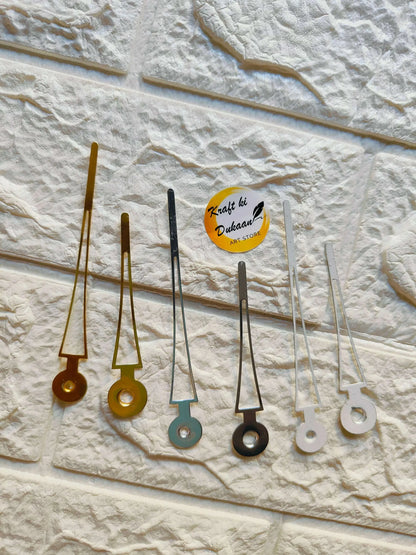 Metal clock hands set, mixed gold, black, teal, and white accents