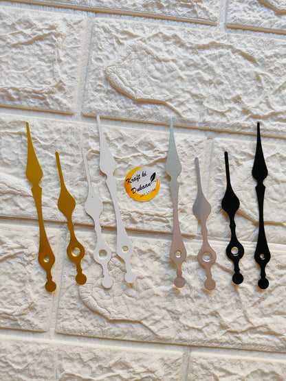 Set of metal clock hands for crafts in gold, silver, and black for DIY projects