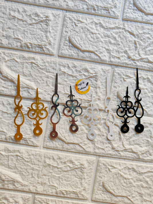 Set of metal clock hands for crafts in various colors including gold, silver, and black