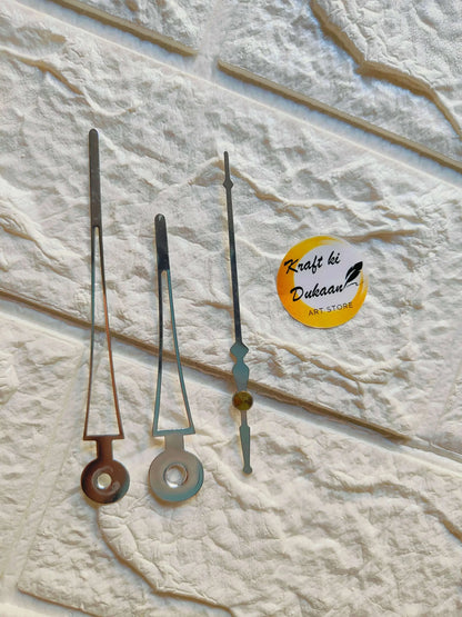 Metal clock hands set with silver, black, and teal/blue accents