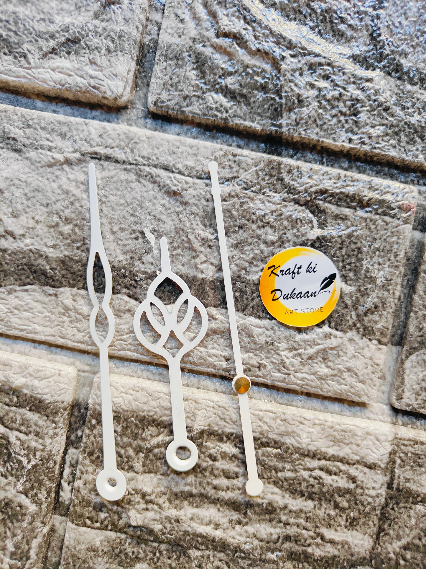 Three elegant metal clock hands for crafts with unique designs from Kraft ki Dukaan