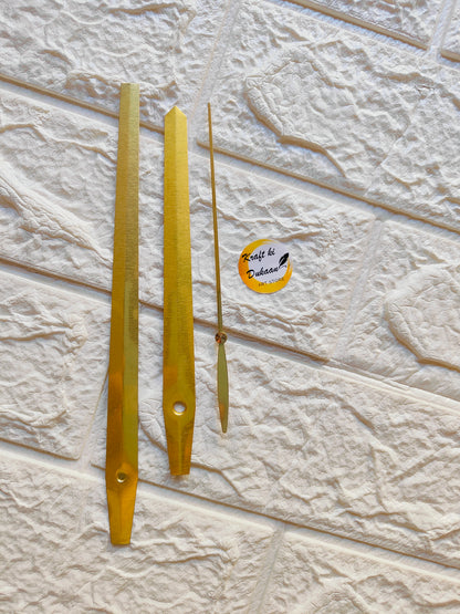 Gold metal clock hands for DIY projects, designed for custom clock creations and repairs