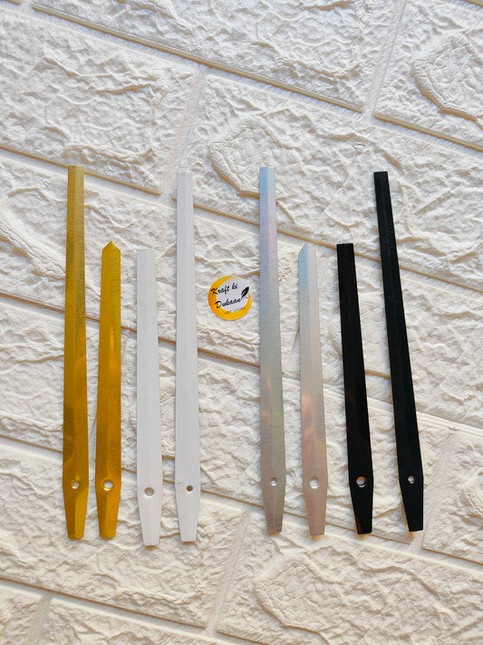 Assorted metal clock hands for DIY projects in gold, silver, white, and black colors