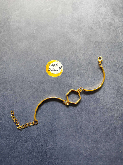 Gold metal bracelet with hexagon charm links and adjustable chain