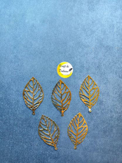 Metal leaf A2 toppers: gold leaf embellishments arranged in a row