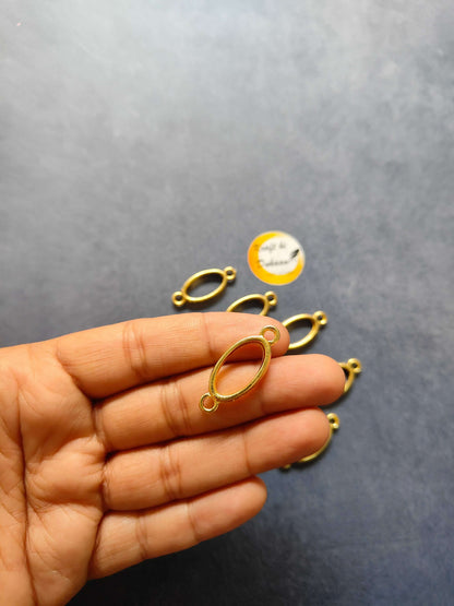 Mini oval bezel bracelet link, gold-tone oval bezel with dark inset