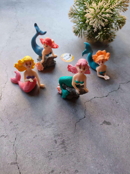 Miniature mermaid figurines set: blue tail, pink hair, orange hair, green tail on base