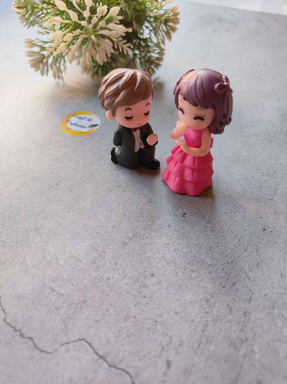 Miniature Model A9: brown-haired boy in black suit with pink-dress girl figurine