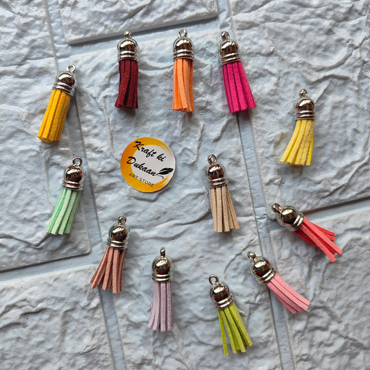Multi-colored tassel jewelry supply featuring vibrant tassels in various colors for crafting projects