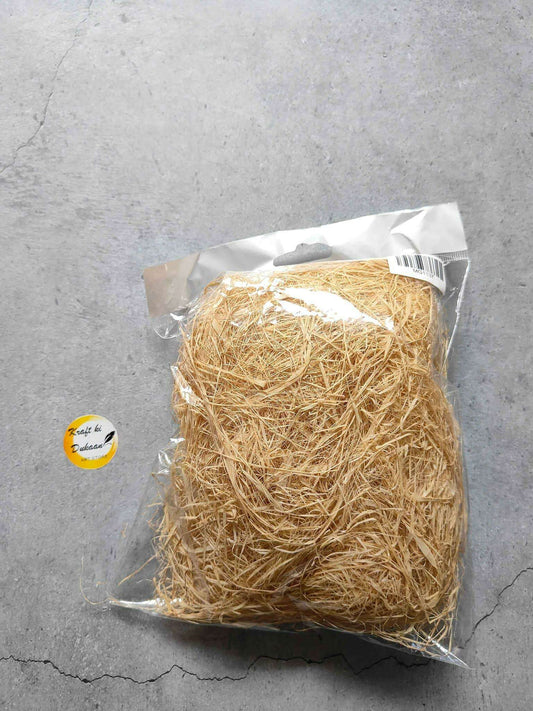 Natural grass thin in clear plastic bag, tan straw fibers