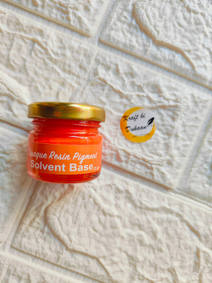 Opaque pigment for resin in vibrant red color contained in a small jar with gold lid
