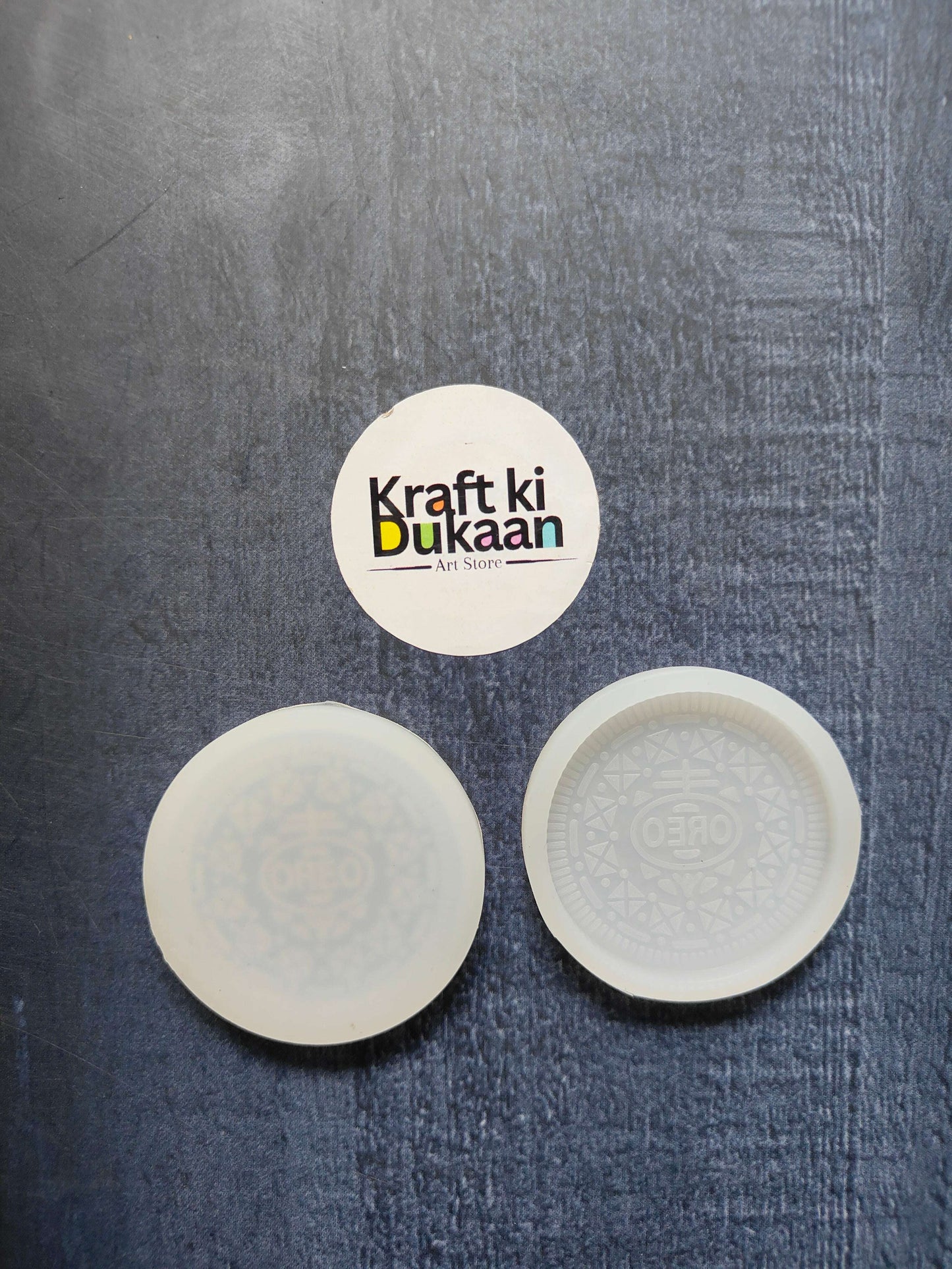 4.6cm Oreo biscuit mould—round silicone disc, one plain and one with Oreo pattern.