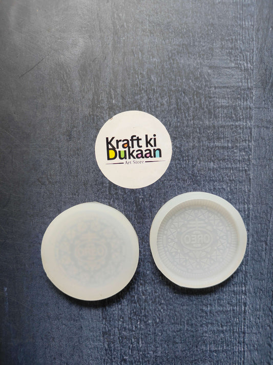 4.6cm Oreo biscuit mould—round silicone disc, one plain and one with Oreo pattern.