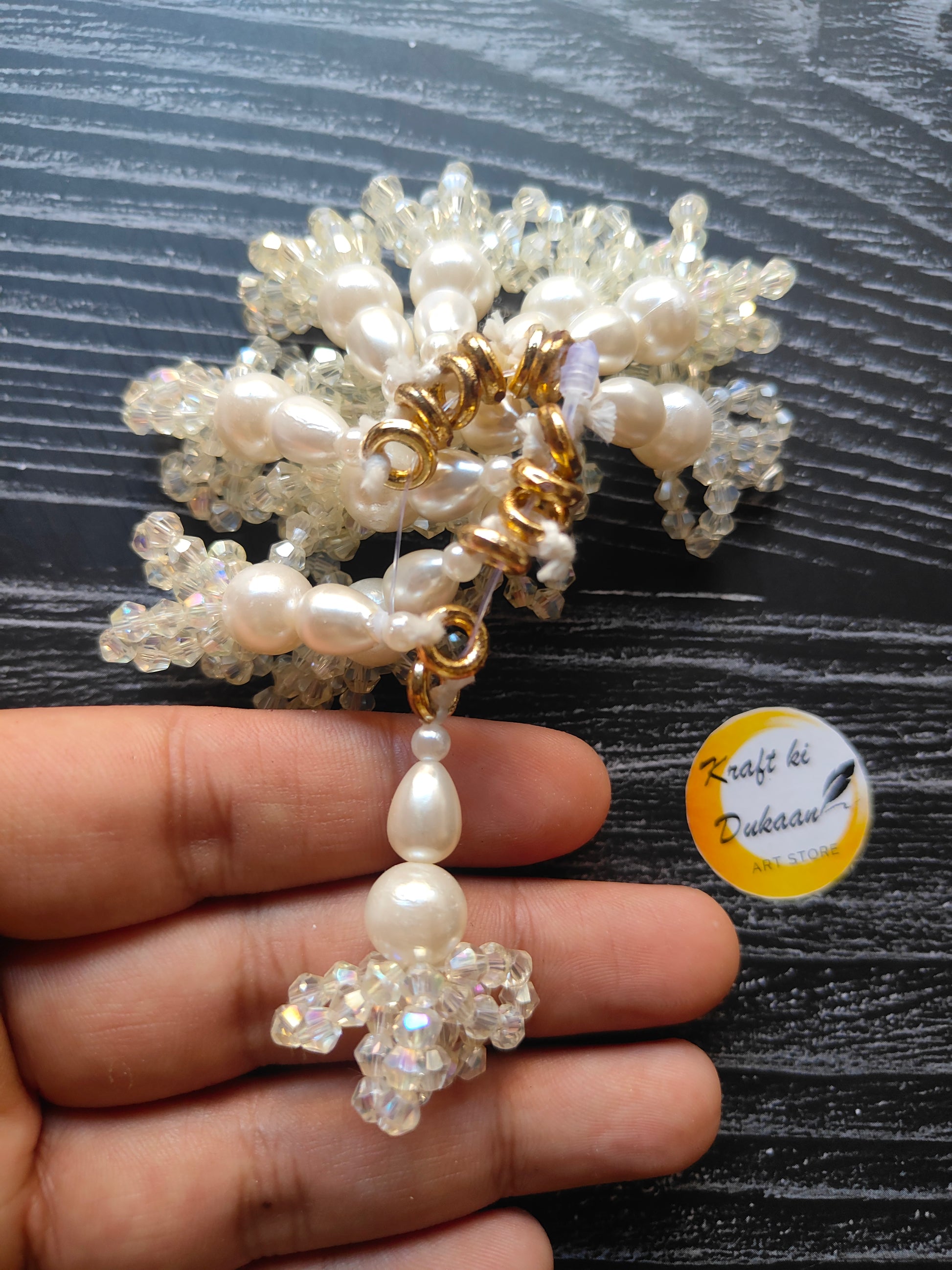 Pearl latkan set for crafts featuring sparkling beads and intricate design in hand
