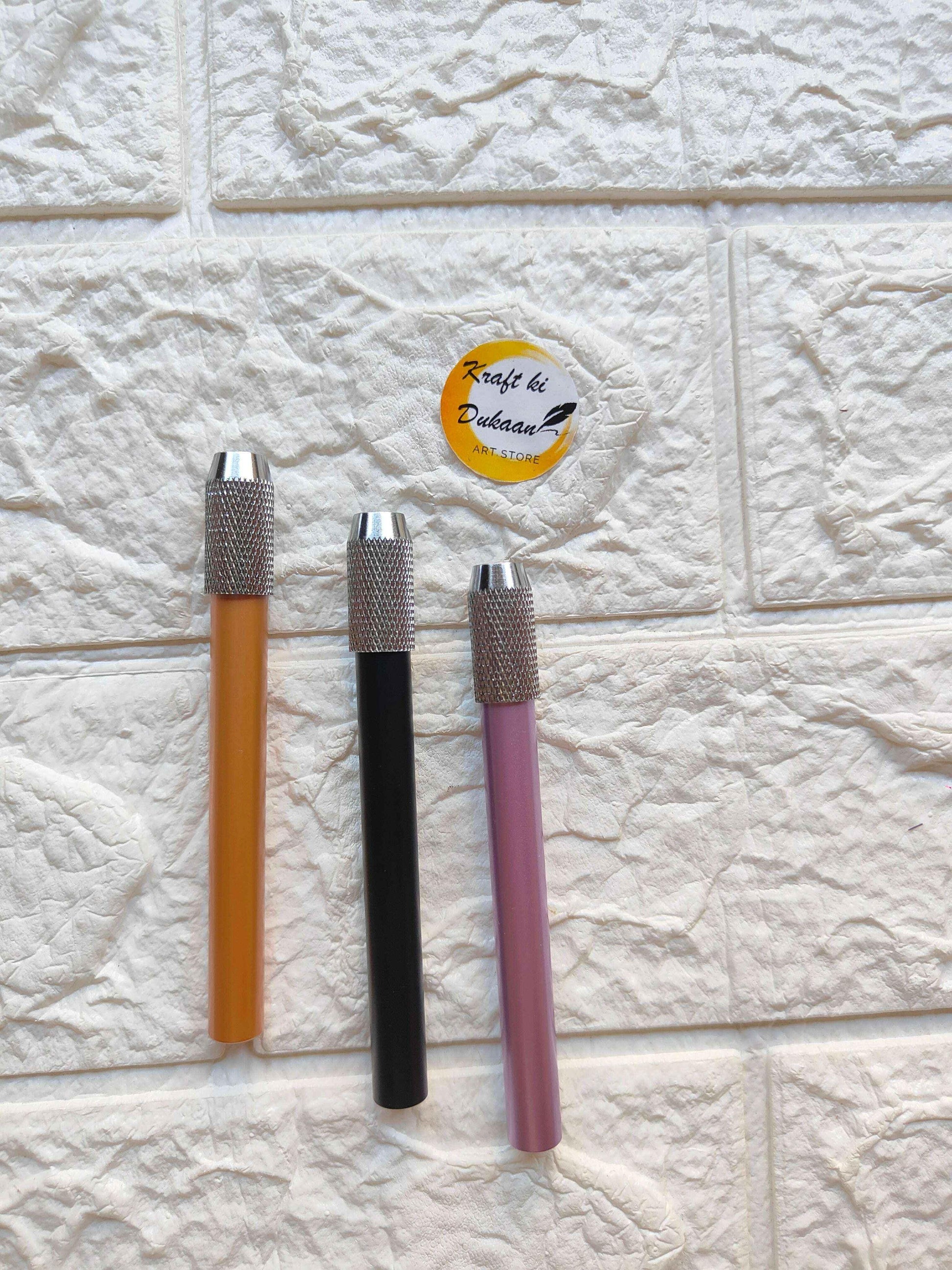 Pencil extender set with orange, black, and pink bodies and textured metal tip